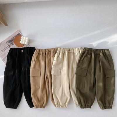 China Breathable Winter Trousers Children 2021 Winter Pants Fleece Thickening Warm Pants Baby Big Pockets Corset Feet for sale