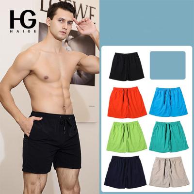 China 2022 QUICK-DRY European and American pants men's beach spring and summer quick-drying loose seaside vacation shorts swimming quarter pants for sale