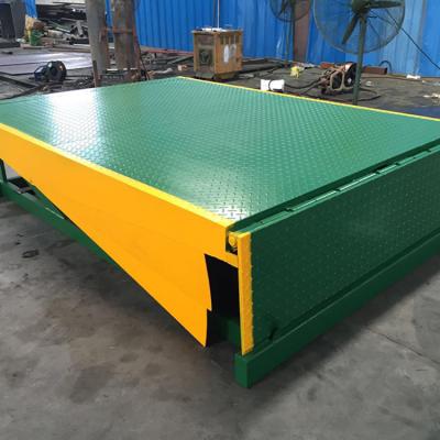 China Fixed Hydraulic Dock Ramp 12 Ton Loading Container Leveler Electric Lift 8 Ton 10ton for sale