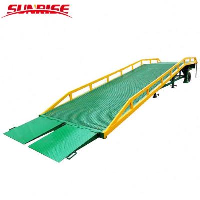 China Hydraulic Mobile Forklift Container Ramps 10ton Loading Yard Ramp With Height Adjustable Legs for sale