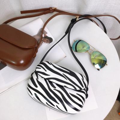 China 2020 new fashion zebra small horse hoof saddle bag mini messenger bag Korean mobile phone bag for sale