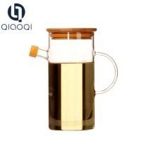 China kitchenware custom wholesale jar glass honey pot with handle glass oil dispenser Te koop