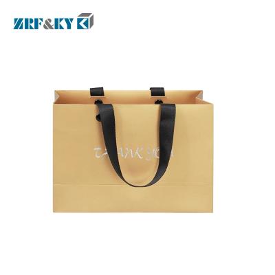 China Recyclable Custom Printed Cardboard Shopping Paper Bags with Flat Rivet Handle for sale