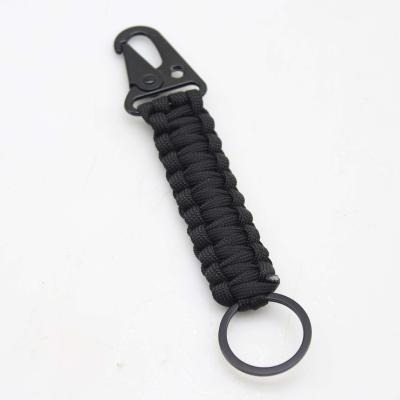 China Outdoor survival Bottle opener keychain outdoor camping and hiking survival toolSeven core umbrella rope mountaineering buckleOutdoor products for sale