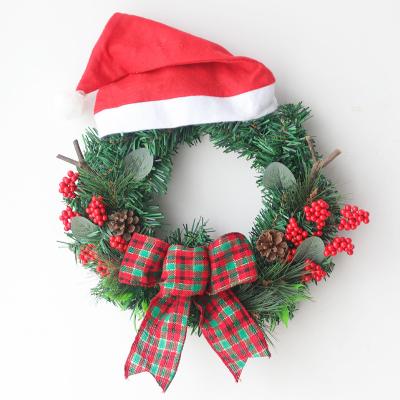 China Hot Selling Popular Decoration Christmas Wreath Door Hanging Little Red Christmas Hat Wreath With Bow for sale