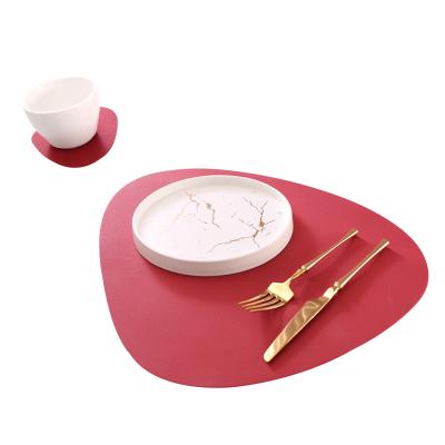 China Durable Leather Pattern Silicone Table Place Mats And Coasters Drop Shaped Anti-Stain Dinner Table Mat for sale