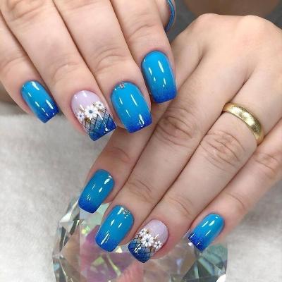 China Not easy to break; Good Flexibility Popular New Products Gently Gel Full Cover Artificial Nail Tips Luxury Nail Art Flowers Blue Press On Nails With Rhinestones for sale