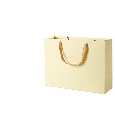 China Recyclable Eco Friendly Ivory Packaging Gift For Clothes Storage Bag High Quality Large Paper Gift Bags Foldable Paper Bags for sale