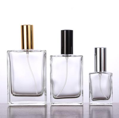 China Personal Care 10ml-150ml Empty Clear Flat Square Glass Perfume Bottle With Spray Lid for sale