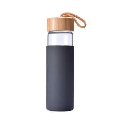 China Sustainable Portable Reusable Environmental Friendly Silicon Glass Water Bottle With Bamboo Lid And Silicone Sleeve for sale