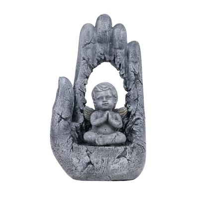 China China Baby Sitting In Hand Resin Mini Angel Figurine Zen Meditation Buddha Statue for sale