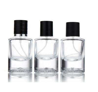 China Custom and wholesale luxury 30ml 50ml personal care glass perfume bottle with black cap for sale