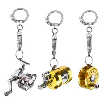 China 2022 New Strong Metal Fish Roll Key Chain Gold Color Fly Fisherman Spinning Fishing Reel Character Miniature Key Chain With Key Ring for sale