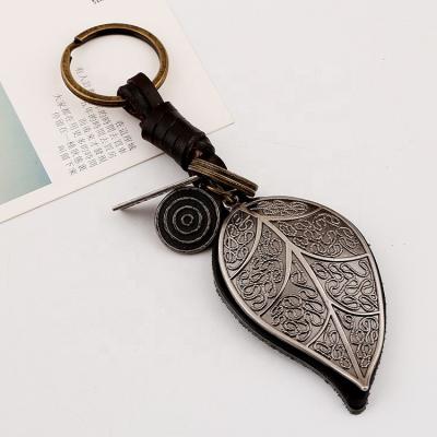 China Vintage Retro Woven Big Leaf Leather Car Bag Accessories Personality Fashion Gift Bag Pendant Key Chains for sale