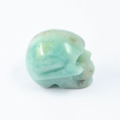 China Decoration Semi-Gem Healing Magic Stone Raw Stone Carved Crystal Skull Gift for sale