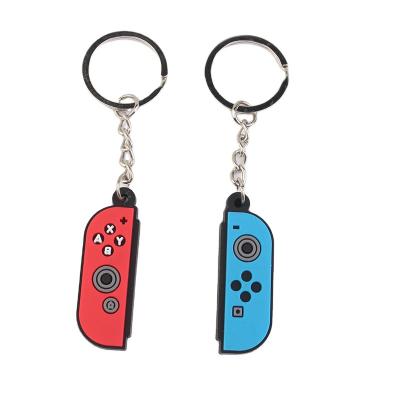 China Promotion gift the popular creative colorful game machine car key chain protection game gift bag key pendant for sale