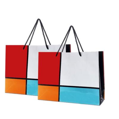 China Recyclable Wholesale Cheap Custom Shopping Paper Carrier Bag Twist Handle Paper Bag With Handle for sale