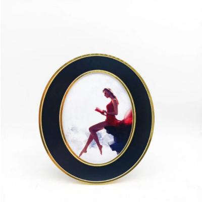 China Zinc Alloy Metal Oval Shape Metal Photo Frames With Glass And Easel Back for sale