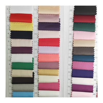 China Wrinkle Resistant Ready Mat Plain Dyed Matte Spandex Polyester Satin Woven Fabric For Dress for sale