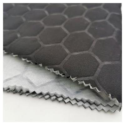 China 100% waterproof quilting fabric polyester pongee waterproof football embossing quilted fabric for winter jacket for sale