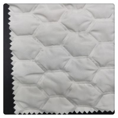 China Anti-Static 100 Polyester Football Embossing Quilted Fabric 300T Polyester Pongee Padded Quilted Fabric For Jacket for sale