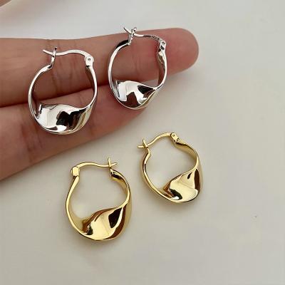 China Vintage s925 Sterling Silver Twist Metal Cold Earrings Personality Earrings Luxury Gold Plated Silver Earrings for sale