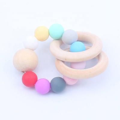 China Durable Baby Care Bracelets Wooden Teether Silicone Beads Wood Ratchet Toys Baby Teether Bracelets Care Toys for sale