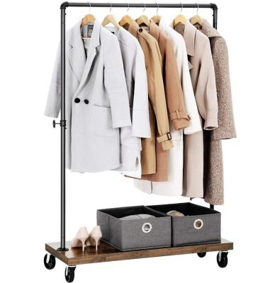 China Sustainable Industrial Pipe Style Garment Rack With Sheves Rustic Locking Wheels for sale