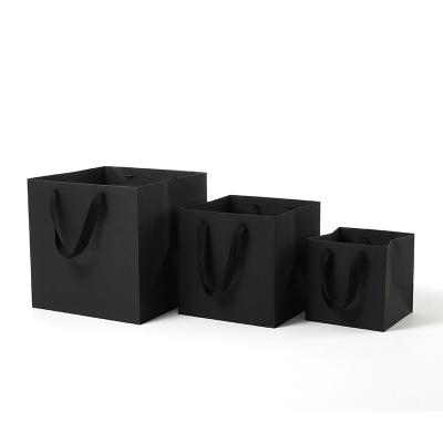 China Recycled materials suitable for multiple scenarios packaging boutique paper shopping bag for sale