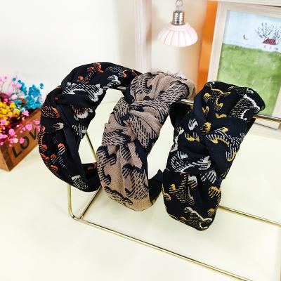 China European and American wide print design bone edge circle hair art fabric bottoms winter autumn new style knot cross hair circle for sale