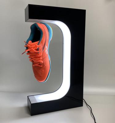 China Durable Rotating Shoe Display Stand Magnetic Levitation Magnetic Floating Shoes Display With Led Lights for sale