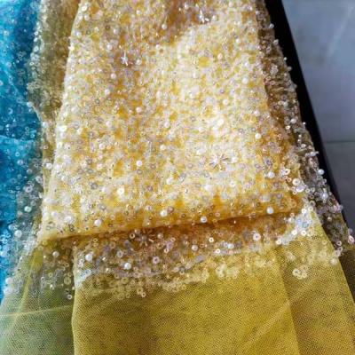 China Viable popular factory direct supplier design Dubai elegant bridal wedding tulle sequin beaded embroidery fabric lace for wedding for sale