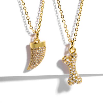 China TRENDY CLARMER Fashion Jewelry Female Gold Plated Bone Tooth Studded Diamond Zircon Pendant Necklace for sale