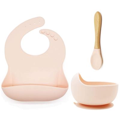 China BPA Free Silicone Eco Friendly Baby Feeding Set Include Suction Cup Baby Spoon With Wooden Adjustable Bib for sale