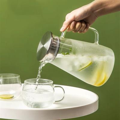 China Viable Cold Water Glass Jug With Stainless Steel Lid Glass Carafe For Juice Lemon Water Iced Tea Glass Jug for sale