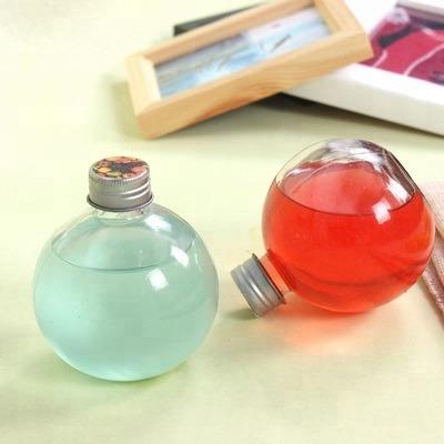 China 250ml Glass Ball Wine Liquor Bottle Gift Shape Clear Lead Free Glass Milk Tea Juice With Metal Screw Cap for sale