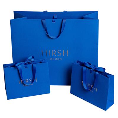 China Recycled Materials Printing Logo Wholesale Retail Carrier Shopping Custom Paper Bag For Packaging for sale