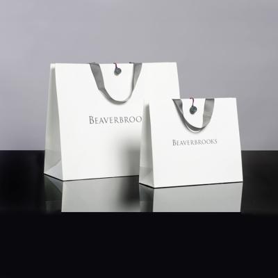 China Recycled Materials Wholesale Custom Logo Empty Unique Fancy Gift Luxury Bags Brand White Paper Bag for sale