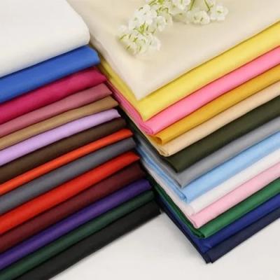 中国 100 Soft Waterproof 190T 210T Textile Price Waterproof Silk Plain Lining Taffeta Polyester Fabric 販売のため