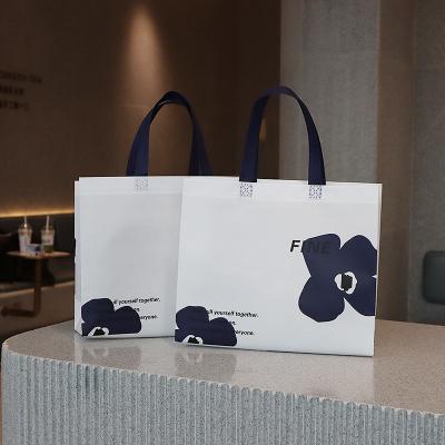 China Portable PP Plastic Handled Bags High Quality Used PP Woven Bag Plastic Shopping Bag for sale