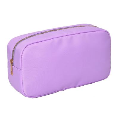 China Low MOQ Custom Toiletry Bag Running Fashion Waterproof Nylon Fabric Personalized Letters Cute Makeup Chenille Cosmetic Bag for sale