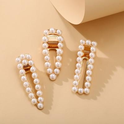 China Hot Sale Fashion Vintage Geometric Irregular Gold Plated Hair Accessories Set Metal Hair Clip Pearl Hair Clip for sale