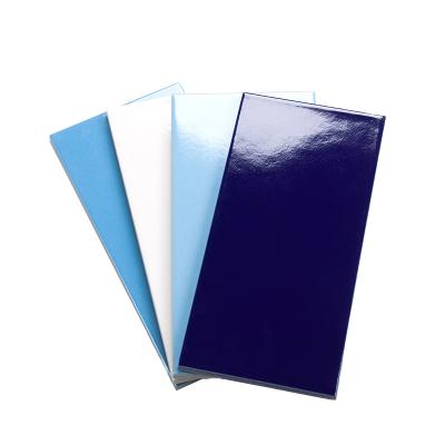 China Dark Blue Ceramic Glossy Tile 240x115mm Pure Cheap Commercial Glazed Metallic Pool Tiles For Flooring for sale