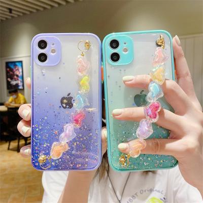 China Luxury Anti-fall Drop Glue Epoxy Heart Hand Chain Phone Case for iphone 13 max pro 12 pro phone cover girl for sale