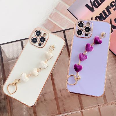 China Luxury Anti-drop Plating Love Heart Phone Case For iPhone 13 Pro Max Phone 12 Case Straps Wrist Heart Mobile Chain for sale