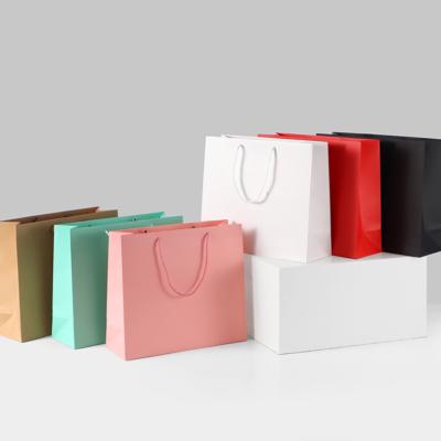 China Wholesale Luxury Custom Jewelry Tote Colorful Pink Paper Bag Package Logo Gold Hot Stamping Wedding Gift for sale