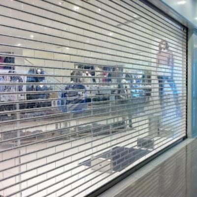 China Heat Insulation Polycarbonate PC Interior Roll Up Roller Shutter Rolling Doors For Commercial Mall Store Shopping Market for sale