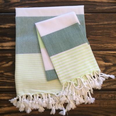 China 100%cotton hammam beach towel compressed turkish tunisian fouta towels with fringe tassels for sale