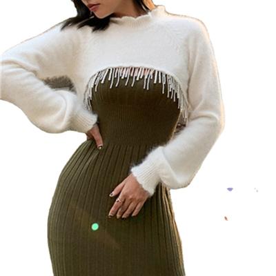 China TWOTWINSTYLE Solid Hollow Casual Soft Breathable Irregular Tassel Slim Knitted Female Sweater for sale