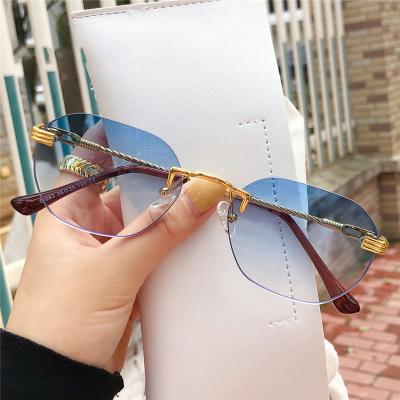 China 10 Years Experience 2021 Brand Designer New Fashion Trendy Men Glasses Diamond Cut Crystal Oval Round Shades Women Unisex Rimless Sunglasses for sale